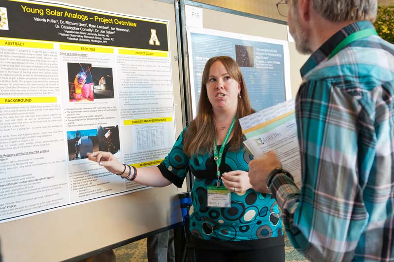 Volunteer poster judge Earl Blodgett with a student presenter at PhysCon 2012 in Orlando, FL.