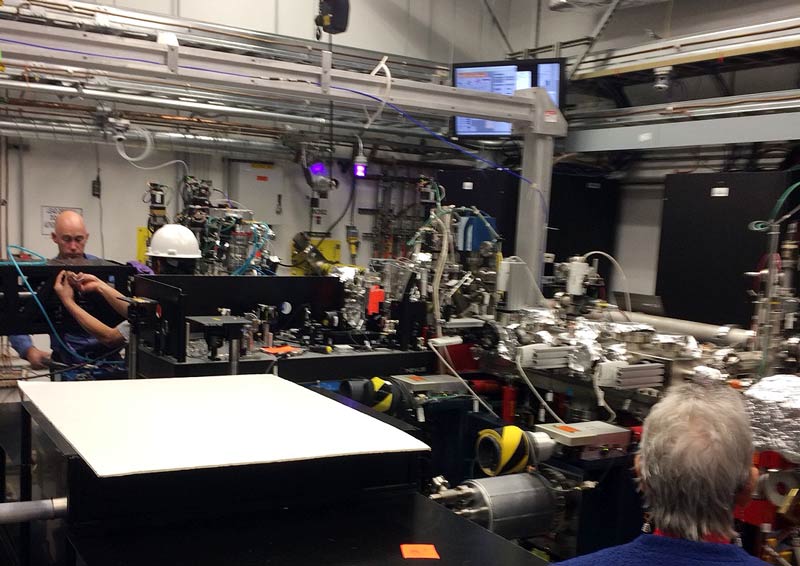 SLAC scientists demonstrating a hands-on approach in one of the labs.