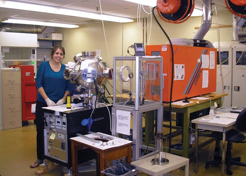 The author poses for a snapshot in her lab at  Towson University.