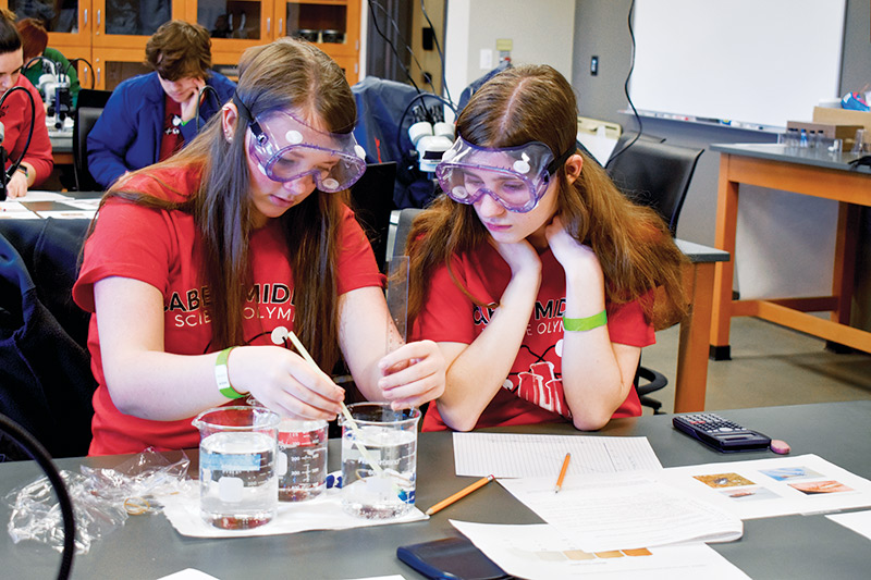 High school students take part in the West Virginia Science Olympiad in 2019 and 2020. The 2021 competition was virtual.