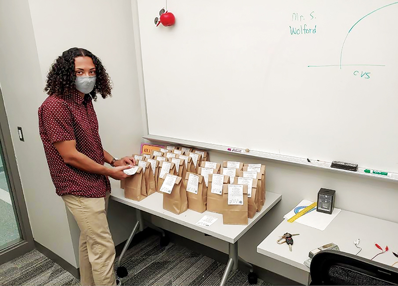 SPS president Sam Williams with 25 bags of experimental materials for the workshop. All images courtesy of Radford University's SPS Marsh White Report.