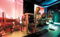 Stanford Synchrotron Radiation Lightsource (SSRL) scientists Piero Pianetta and Jacqueline Kerlegan inspect SSRL's newest X-ray microscope at Beamline 6-2.