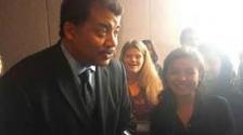 Reporter Lizzie Nance with Neil deGrasse Tyson.