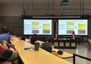 One of the attendees presenting her research.