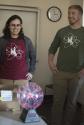 University of Wyoming students brought a fantastic, inexpensive demonstration involving a plasma ball powering nearby  uorescent bulbs.