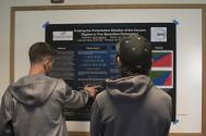 Colorado Mesa Universiy student Scott Jackson (left) presents his research poster.