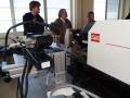 Gaier (middle) and intern Dylan Ford (left) set up their measurement apparatus on a tensile tester. Photo courtesy of Jim Gaier.