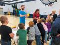 Cade Hensley, MSSU SPS secretary, explains the concept of pressure to the first graders and performs the balloon-on-the-bed-of-nails demo. 