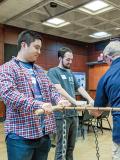 Two students participate in a demonstration with zone councilor Don Williams on torque. Photos courtesy of Shahid Hussain.