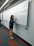 Members of the Illinois Tech physics department face off during a game of physics Pictionary. Photos courtesy of the Illinois Tech SPS chapter.