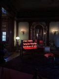 Photo of a neon sign that says "May many futures flourish because of you."