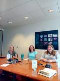 Audry, Amanda, and Sara teaching how to use the library and achrives tools