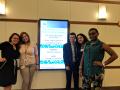 Mikayla, myself, Nathan, Sarah and Elon in front of the final symposium sign