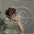 The mirror I etched of a positive kaon decay in a bubble chamber. I gave this piece to my mentor, Crystal Bailey.